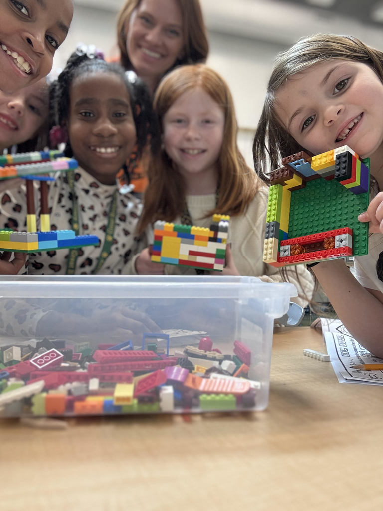 Some of Mrs. Doyle's students on the 101st day of school completing a 101 dalmatian-themed STEM challenge!