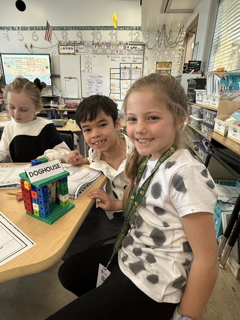 Students completing a 101 dalmatian-themed STEM challenge on the 101st day of school