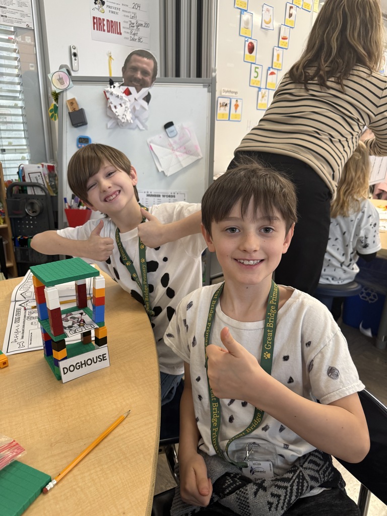 Students completing a 101 dalmatian-themed STEM challenge on the 101st day of school