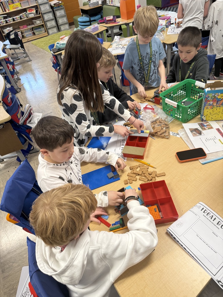 Students completing a 101 dalmatian-themed STEM challenge on the 101st day of school
