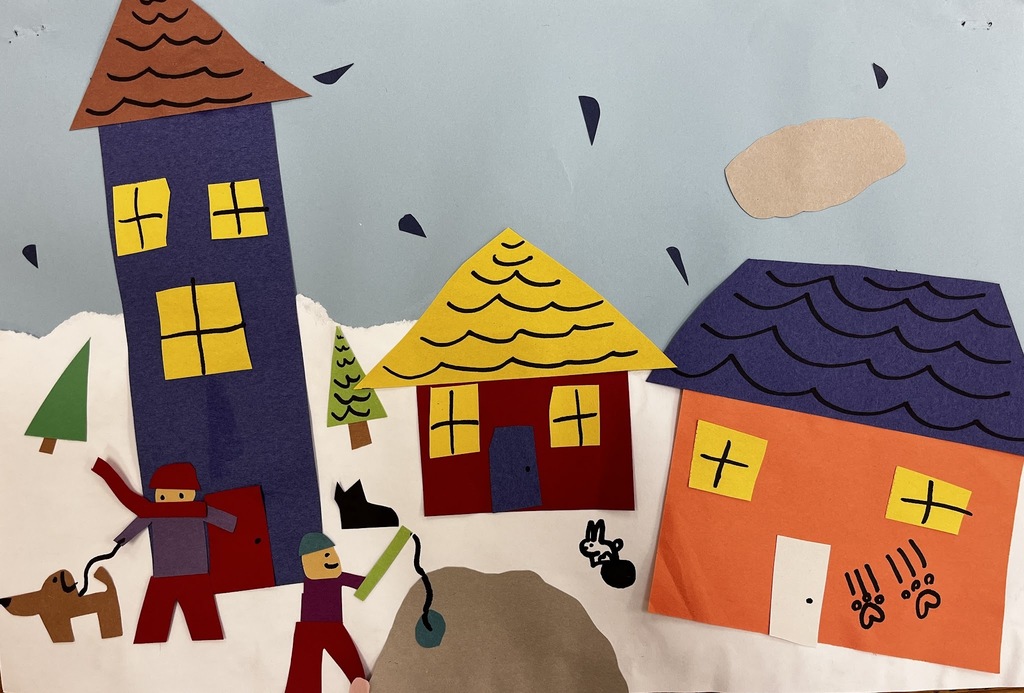 paper cut outs of houses and people 