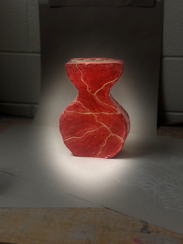 red vase with cracks