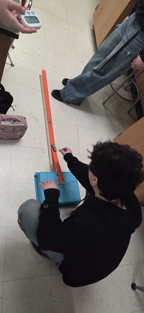 students with hot wheels cars