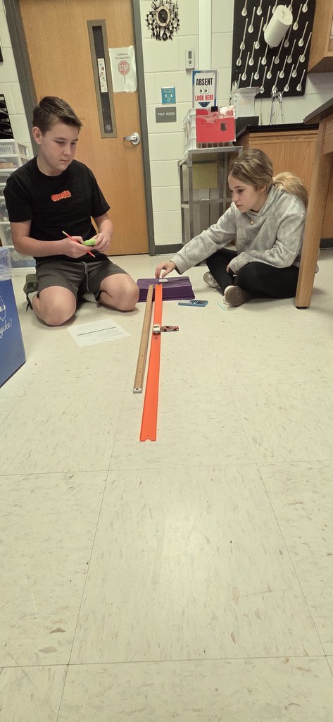 students with hot wheels cars