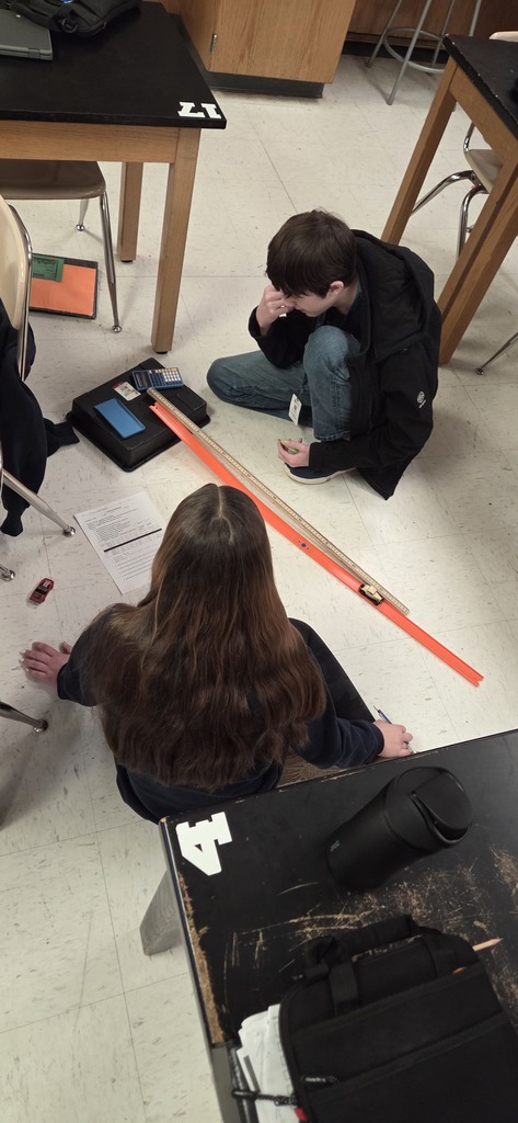 students with hot wheels cars