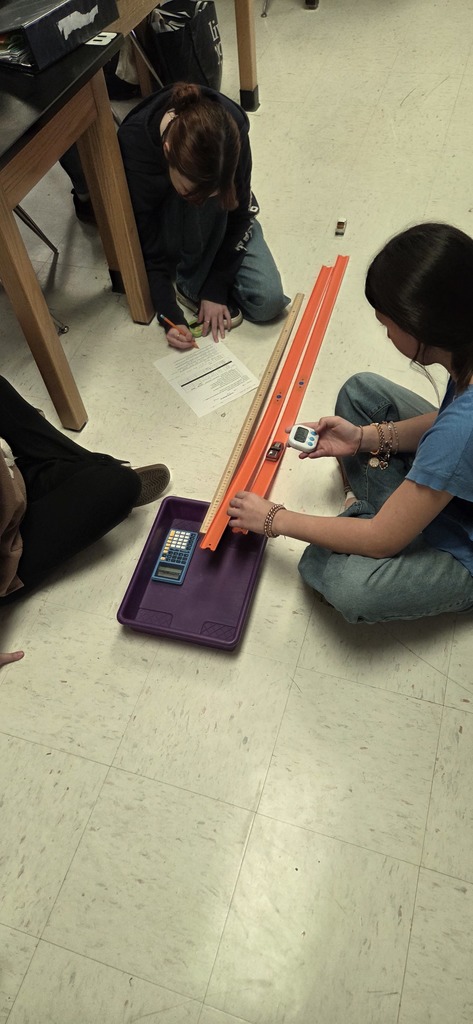 students with hot wheels cars