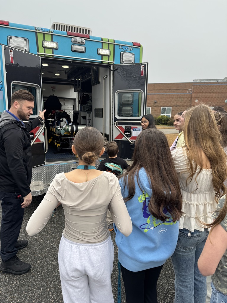 students with CHKD ambulance and the teddy bear donations