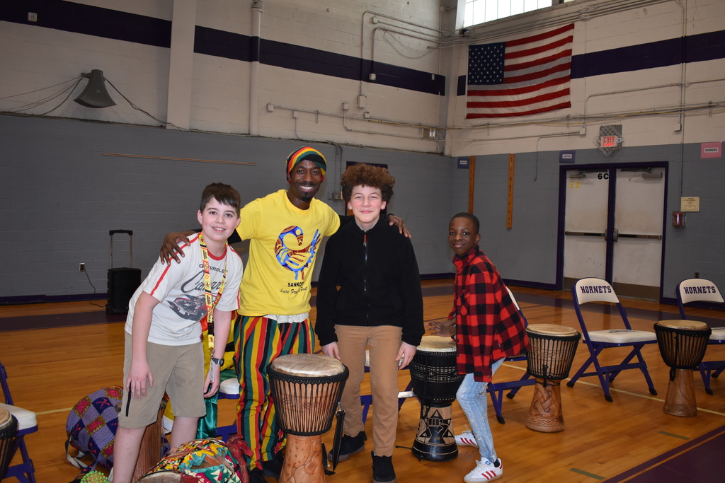 Students posing with Mr. Opoku Reeves