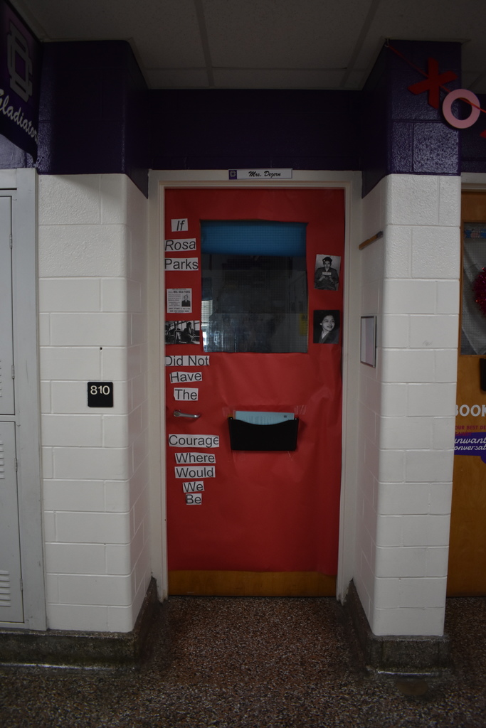 A red door that says "If Rosa Parks did not have the courage, where would we be?"
