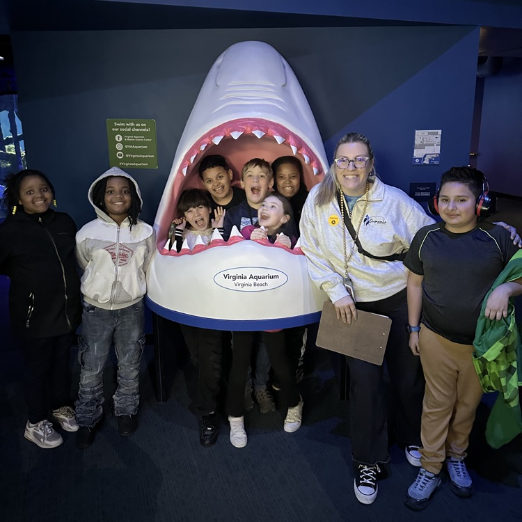 students and teacher in and by the fake shark