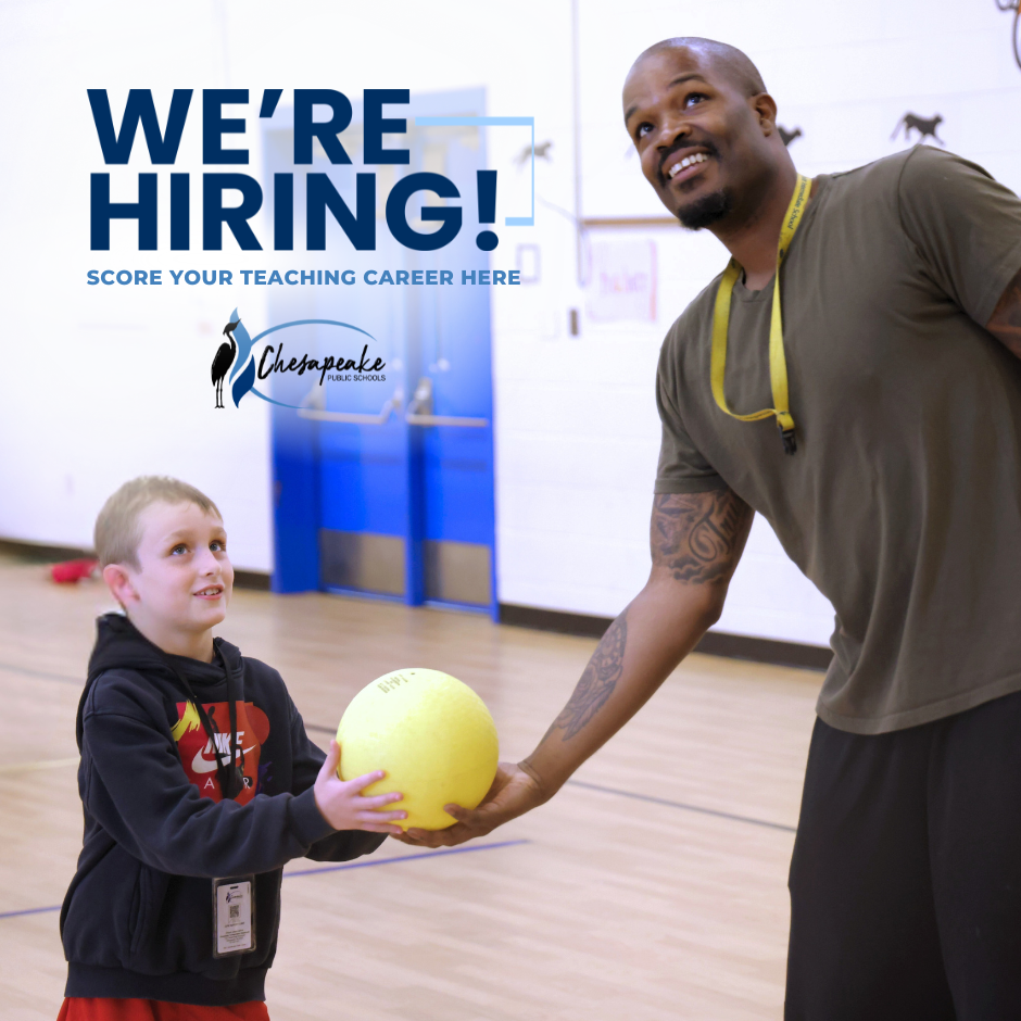 male PE teacher and elementary student holding yellow ball in auditorium.