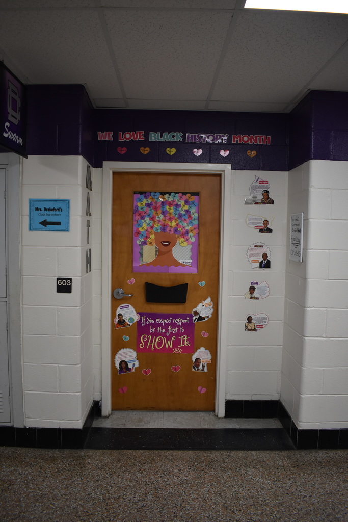 a door celebrating black history month. With a sign that says, " We love black history month!"