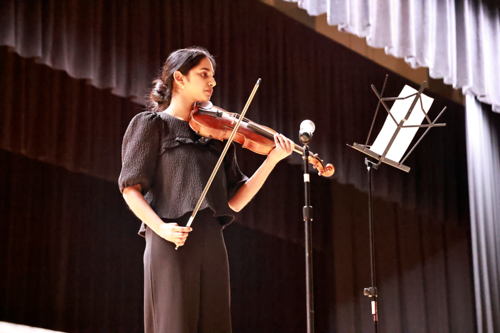 teen playing the violin