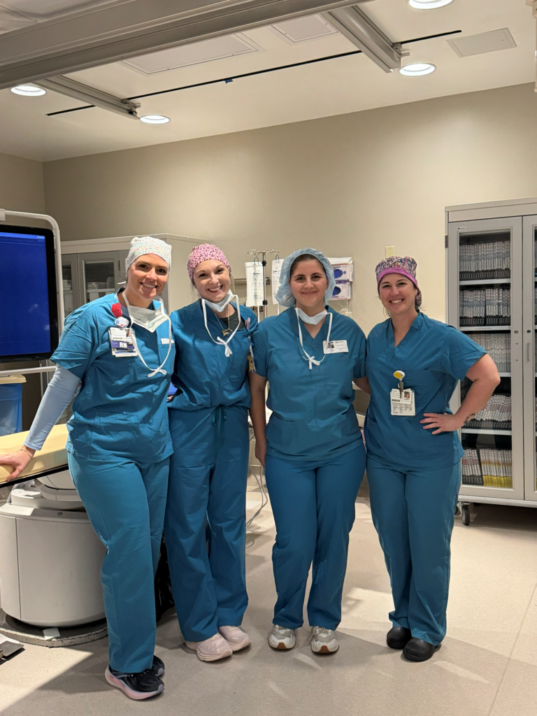 Mentors in students in scrubs