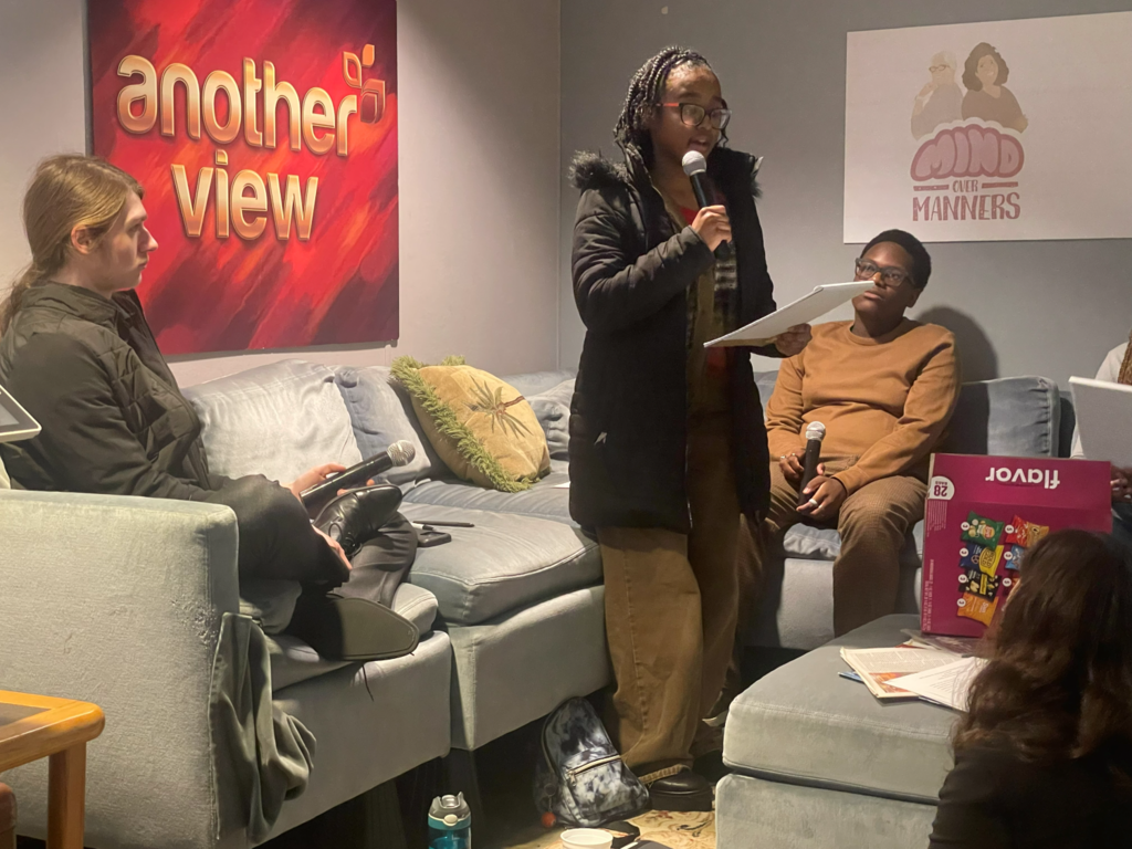 student reading script with microphone