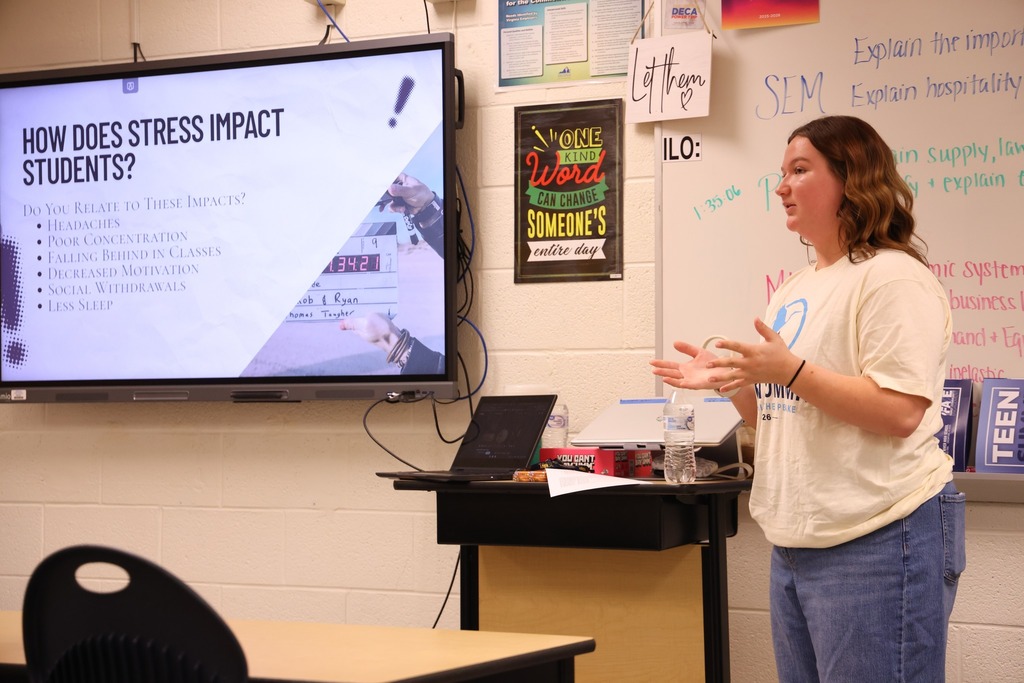 Student volunteer instructing a class.