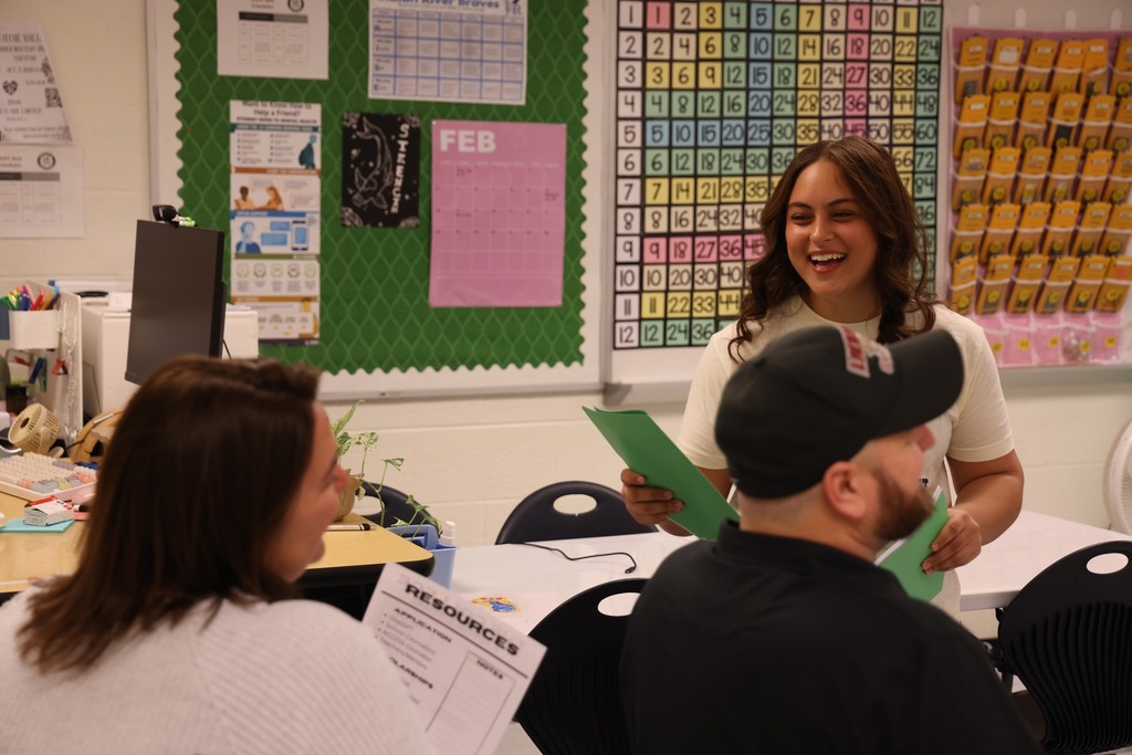 Student volunteer handing out flyers