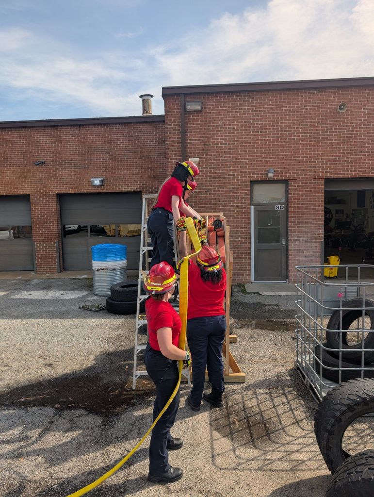 Firefighting students practicing hose drills