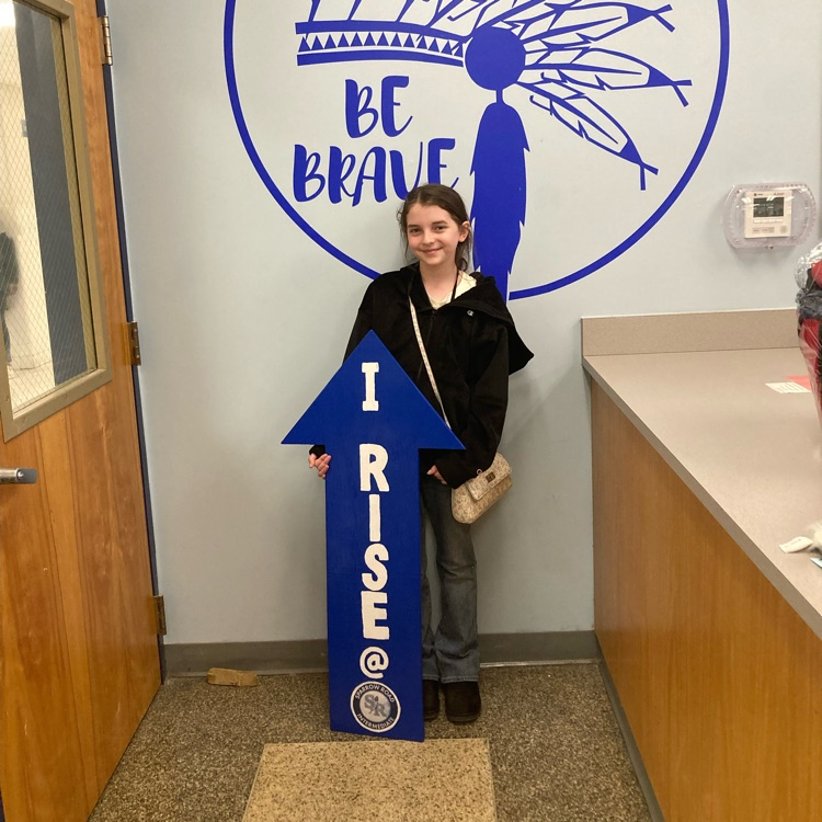 student with RISE arrow