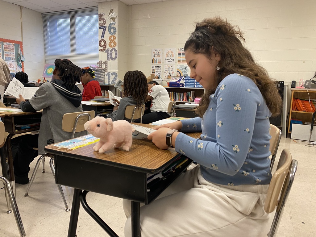 students & staff reading charlottes web