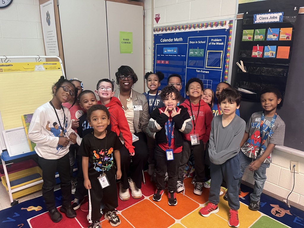 students & staff reading charlottes web