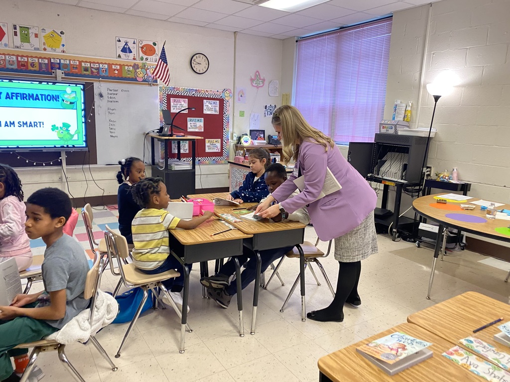 students & staff reading charlottes web