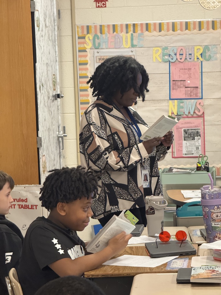 students & staff reading charlottes web