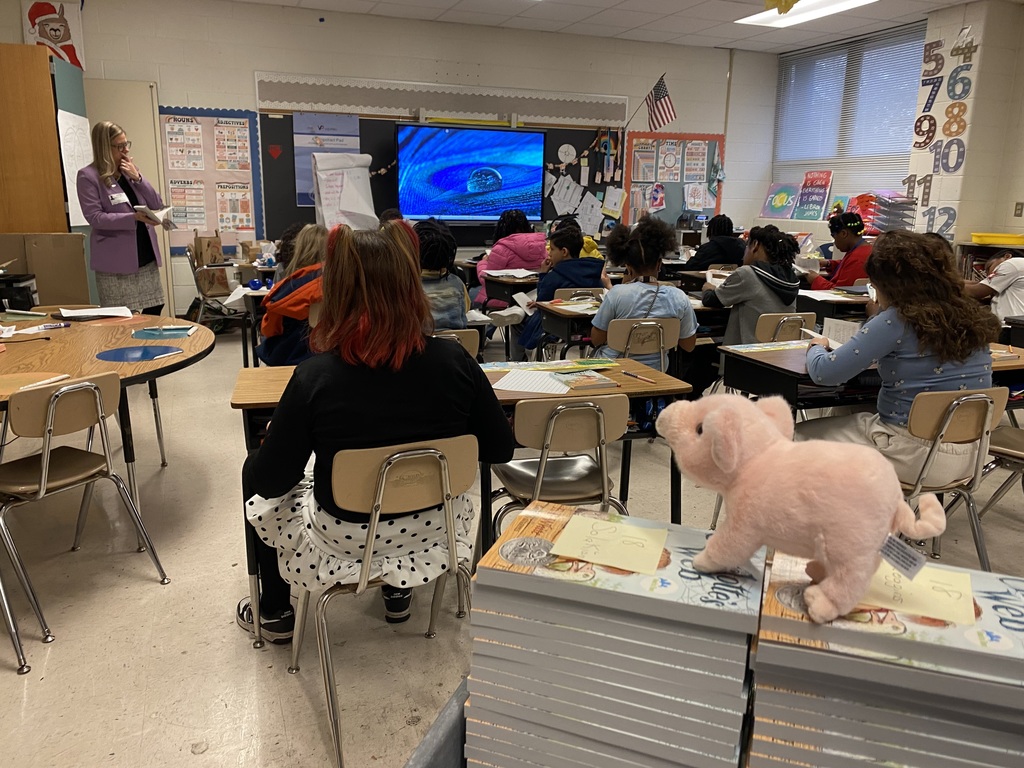 students & staff reading charlottes web