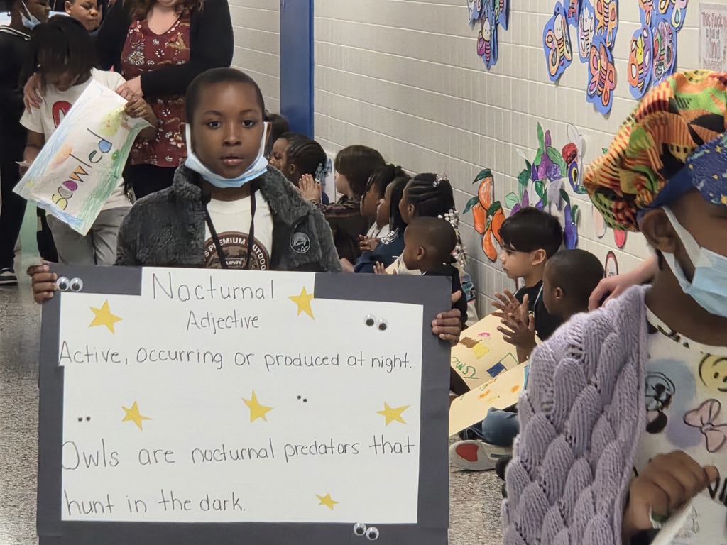 Students with Nocturnal Vocab sign.