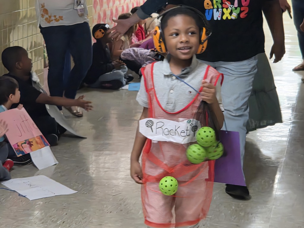 Student dressed as a racket for the vocab parade.