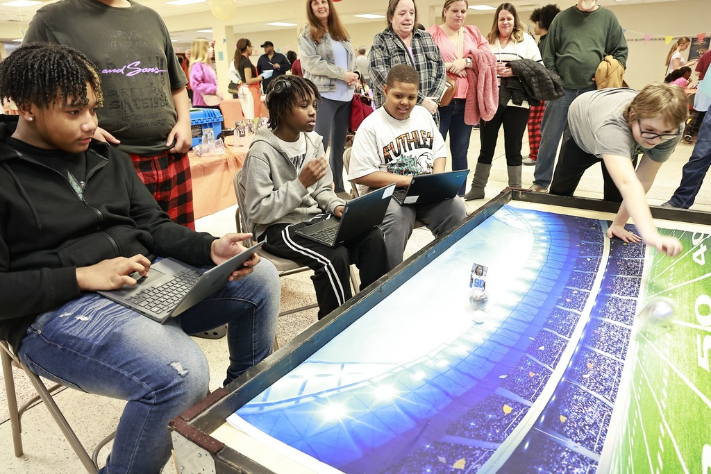 students on fantasy football board playing