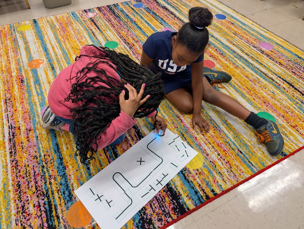 students coding with ozobots and magnets
