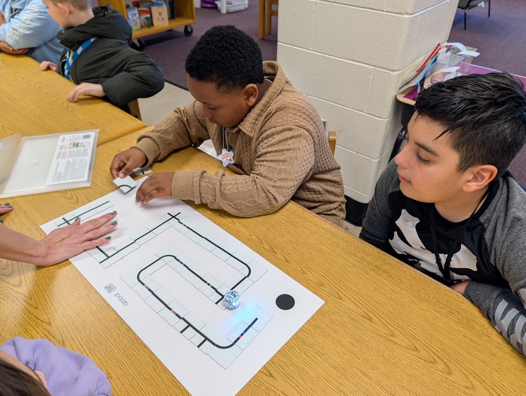students coding with ozobots and magnets