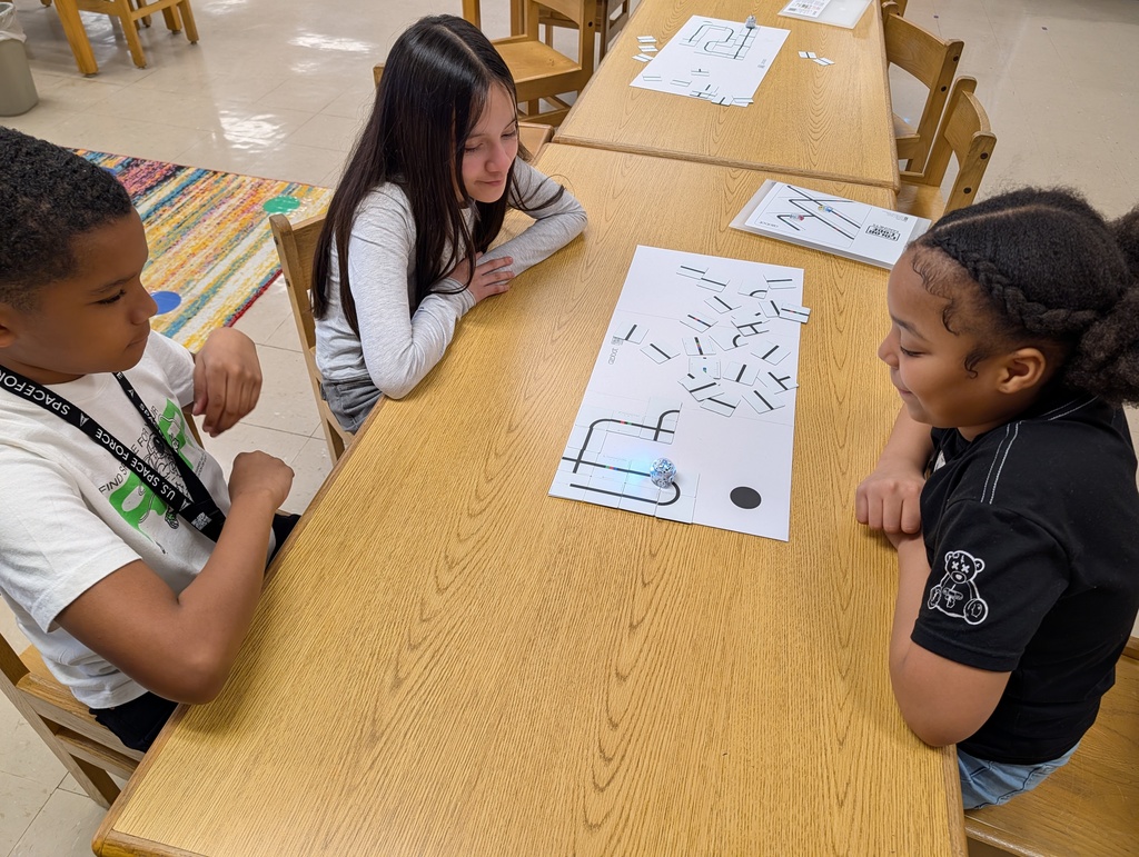students coding with ozobots and magnets