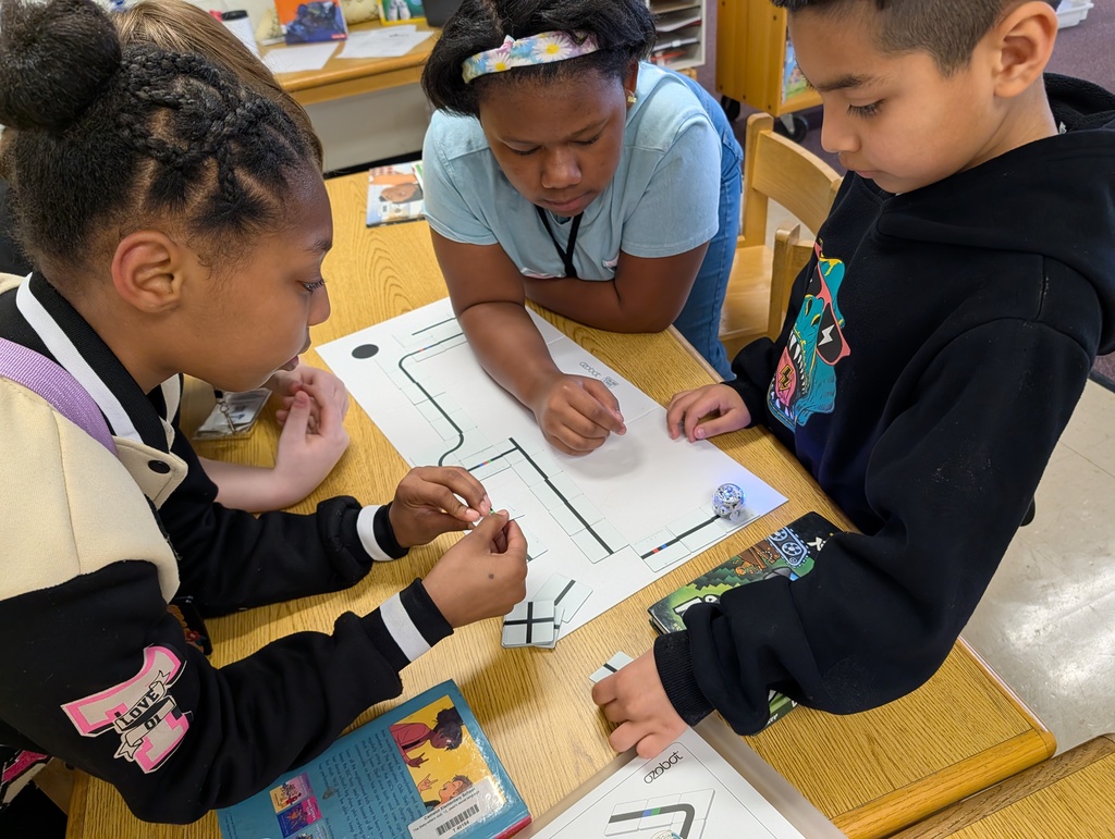 students coding with ozobots and magnets
