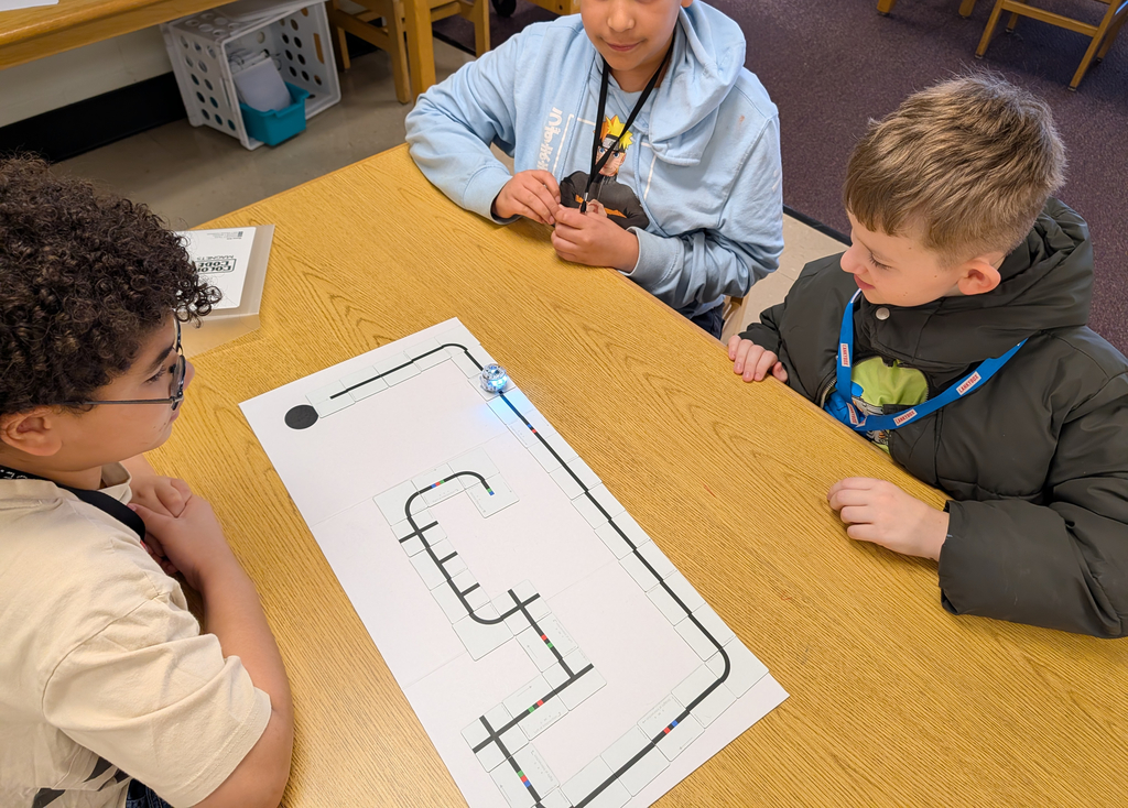 students coding with ozobots and magnets