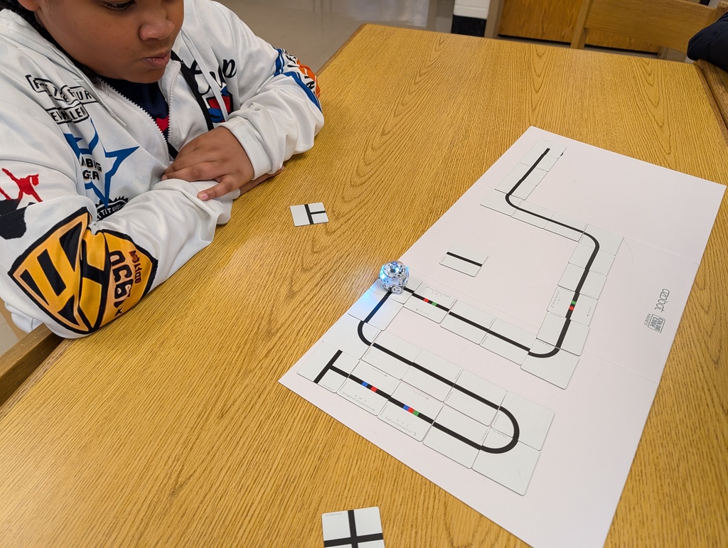 students coding with ozobots and magnets
