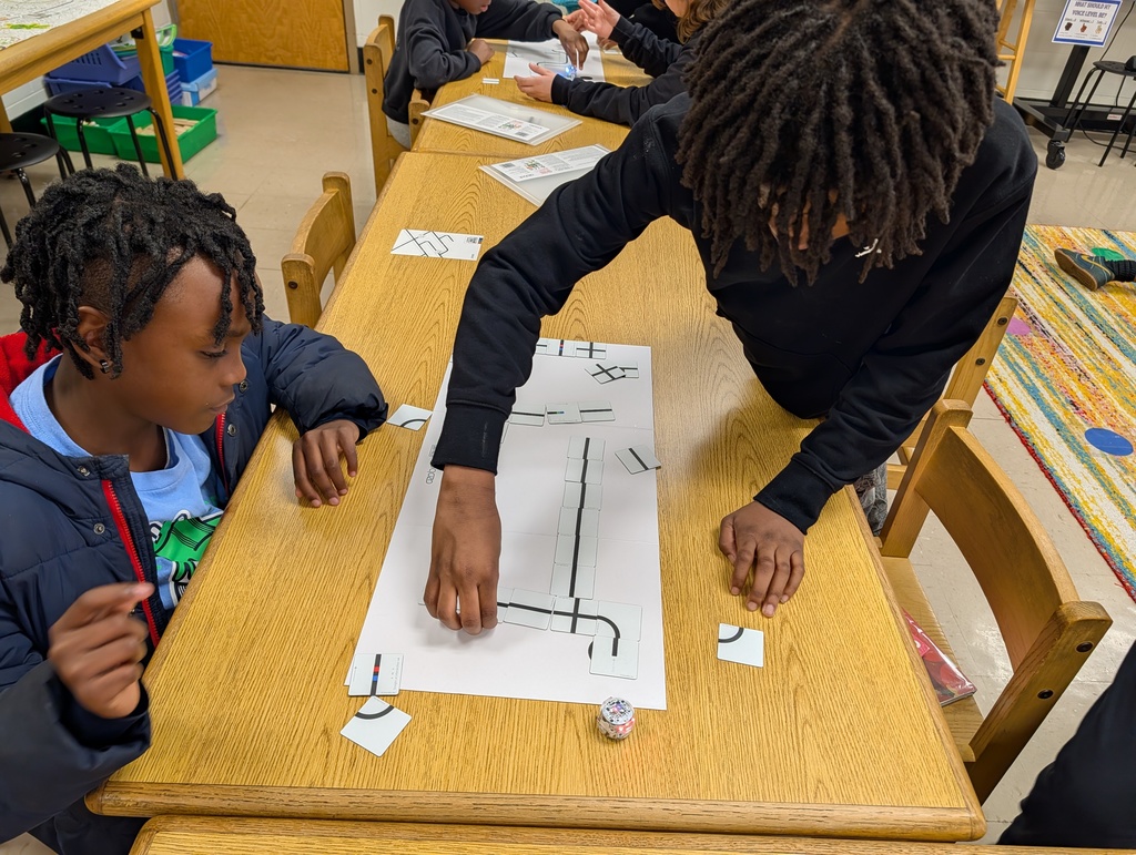 students coding with ozobots and magnets
