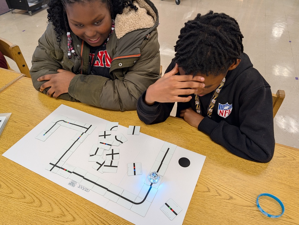 students coding with ozobots and magnets