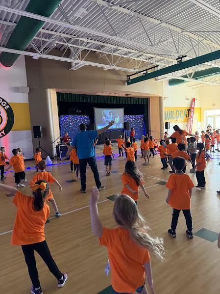 Kindergartners and Mr. Mason dancing at Dance Fit!