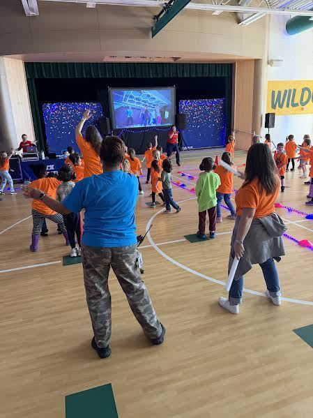 Ms. Baker-Hardison and Mrs. Tucker dancing with students at DanceFit!