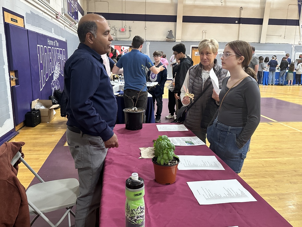 Students attending a booth at Lab and Ladle Night