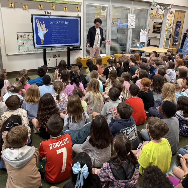 Mr swafford giving a lesson to the second grade bees on Ballet etiquette for their field trip to see Alice in Wonderland 