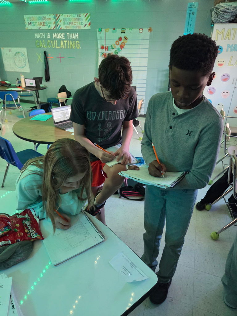 students working on a scavenger hunt in math class