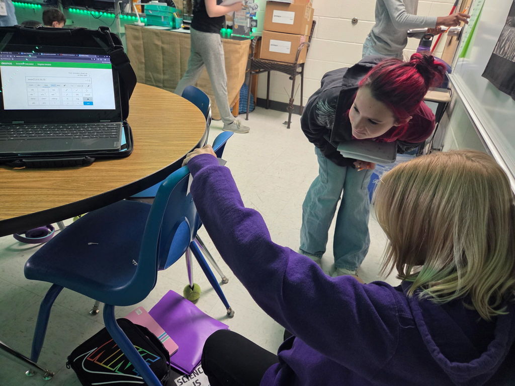 students working on a scavenger hunt in math class