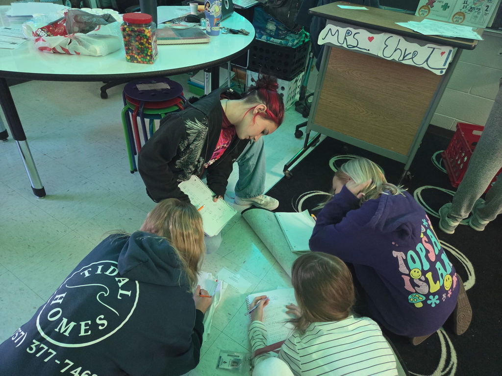 students working on a scavenger hunt in math class