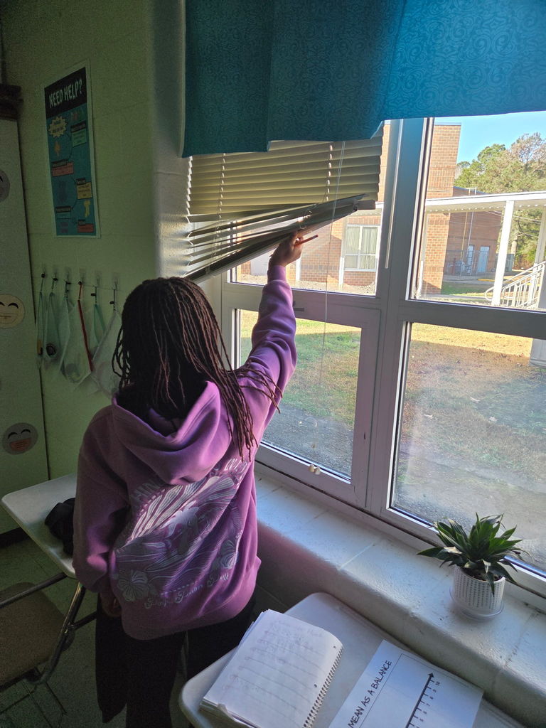 students working on a scavenger hunt in math class