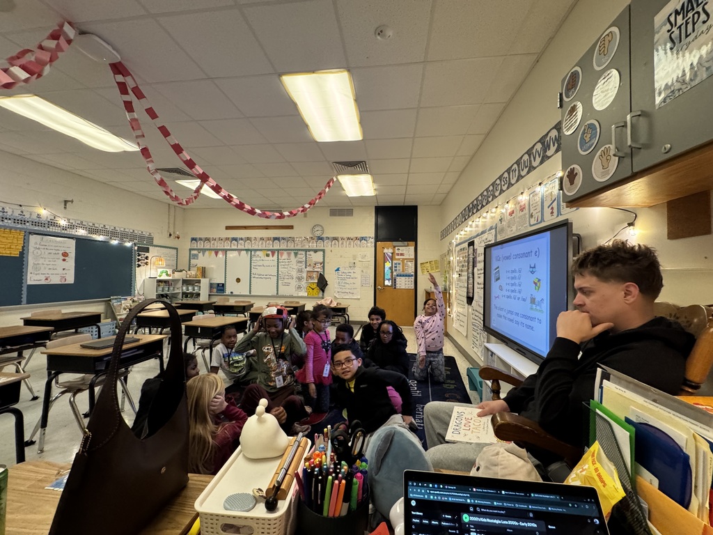 Navy Firefighter reading to class