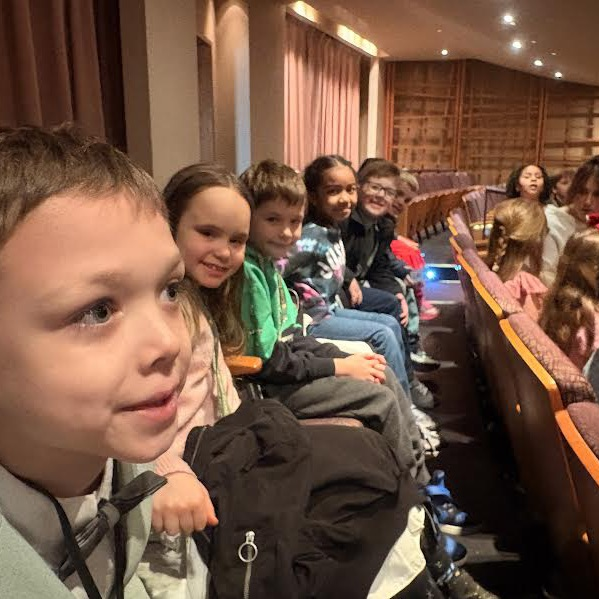 2nd grade students seated and ready to watch the Alice and Wonderland ballet