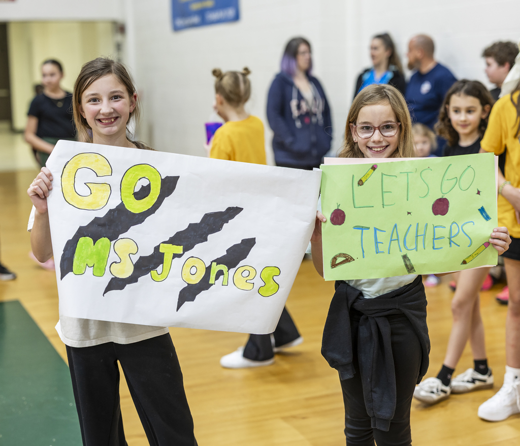 Students made posters to cheer on the teachers and their friends